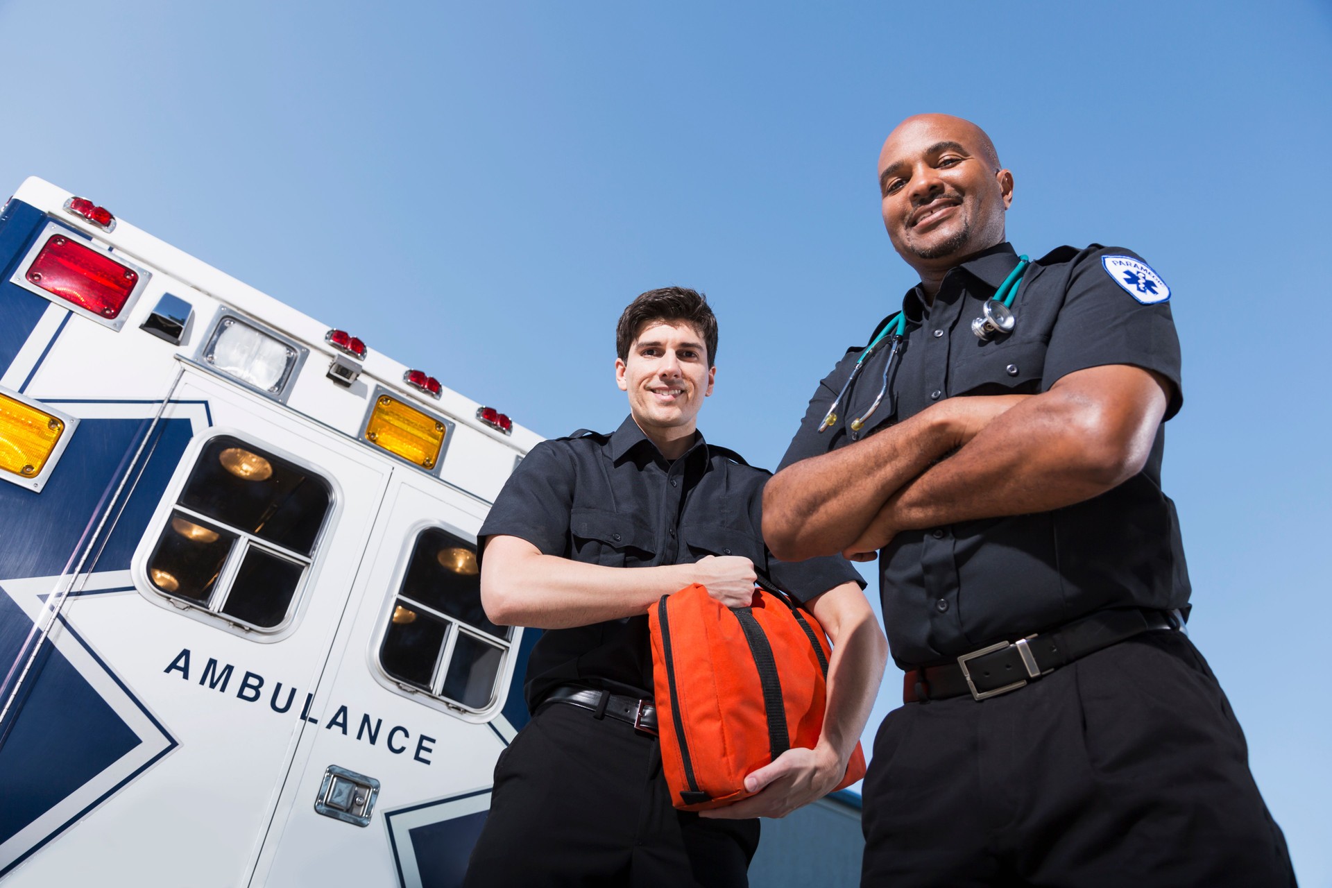 Paramedics at back of ambulance